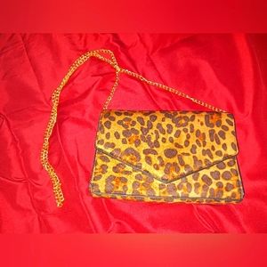 HOXIS cheetah print clutch